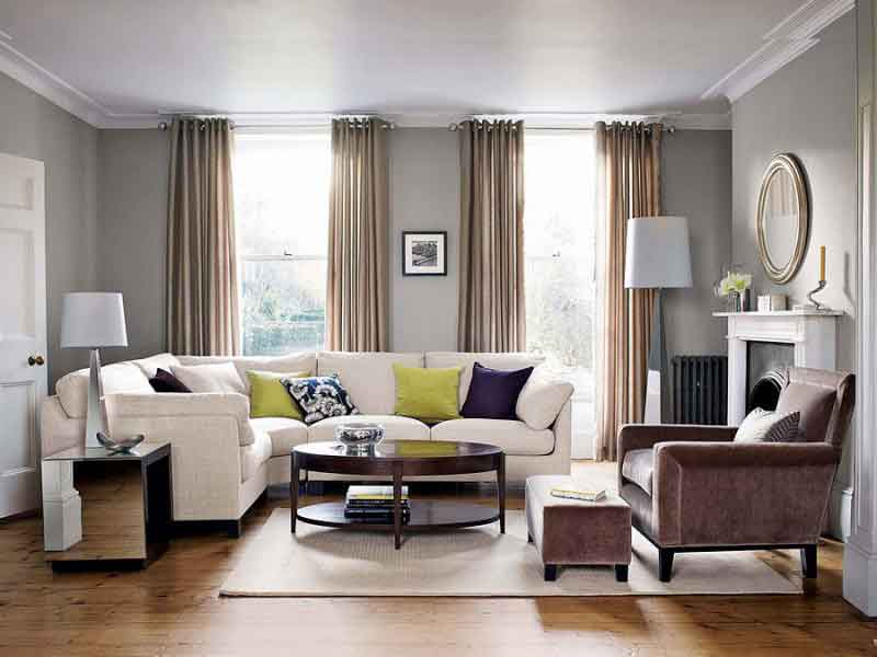Curtains hung at ceiling height making a room look taller